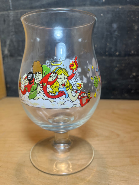 Huvel Belgian beer glass with limited edition 2024 JT Samuels illustration featuring an angel, noodle-like creatures, hop cones, and wheat stalks on its bowl.