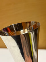 Towle sterling silver jigger shot glass with a sleek midcentury design, featuring small dents on the edges as described in the product details.