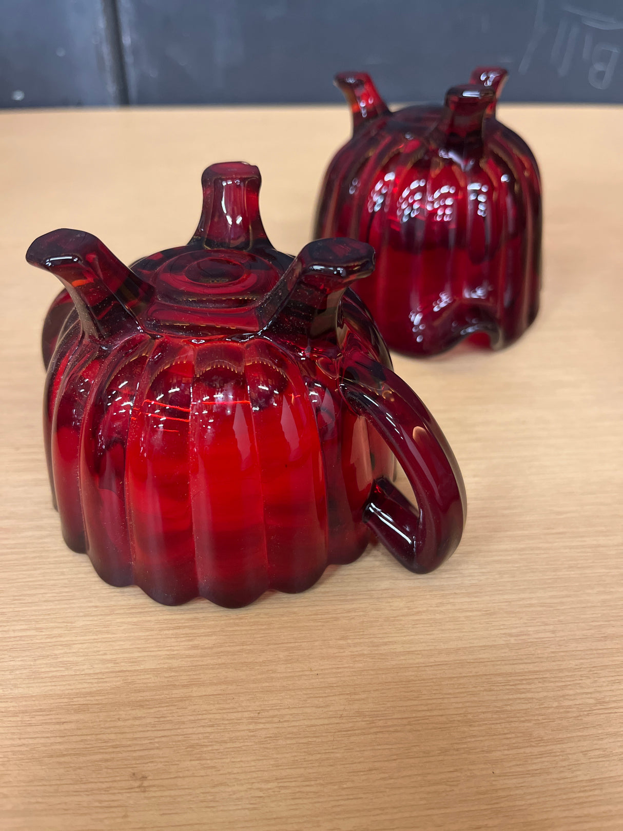 Imperial Glass Co. ruby red creamer and sugar bowl set, showcasing intricate details and vintage elegance from the 1950s, in pristine condition.