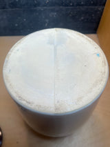 Vintage two-toned ceramic pot with lid, shown upside-down, revealing its unglazed bottom, mold-line seam, and rough foot-ring, ideal for storing pantry items.