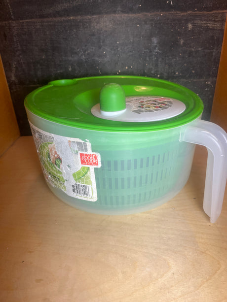 Salad spinner with handle and spout - Good Cook, featuring a perforated basket, locking lid, and a handle with a small crack for easy pouring.