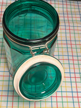 Food storage container with airtight locking lid - vintage faceted green glass