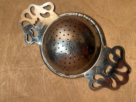Tea strainer - vintage midcentury modern Japanese silver plated, featuring a spherical design with a clasp for loose tea, ideal for efficient brewing.