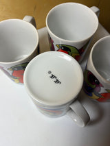 Set of four FF groovy mugs featuring a vibrant bird pattern, showcasing intricate designs and unique artistry, perfect for adding style to your drinkware collection.