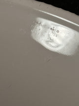 Close-up of the underside of a 4-liter oval casserole dish with lid - PYREX Corning Ware French White F-14-B, showing the CORNING WARE® … MADE IN USA markings.