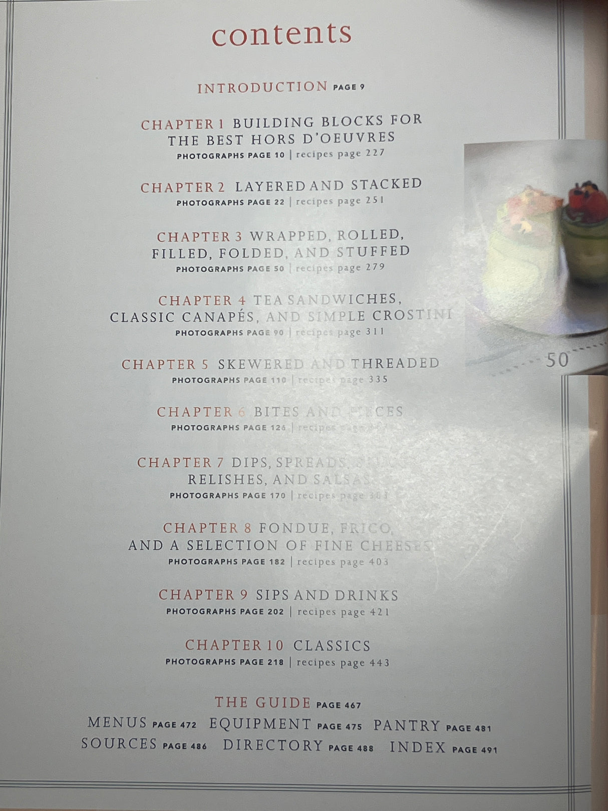 Martha Stewart’s Hors d’Oeuvres cookbook contents page shows chapter titles, page numbers for photographs and recipes, and sections like Menus and Equipment in 'The Guide'.
