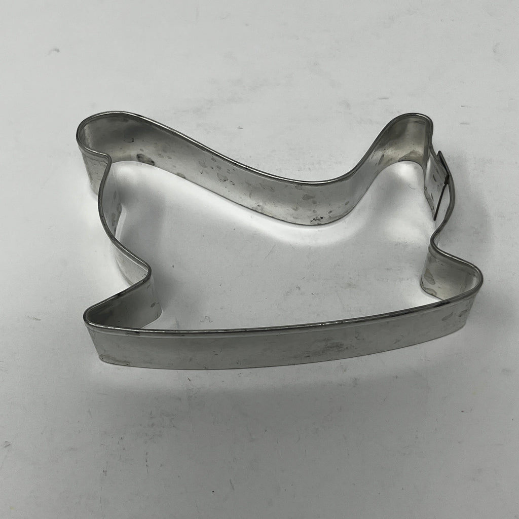 Mid century metal cookie cutter featuring various shapes like moons and stars, including Pillsbury's Comicooky Cutter from the 1930s.