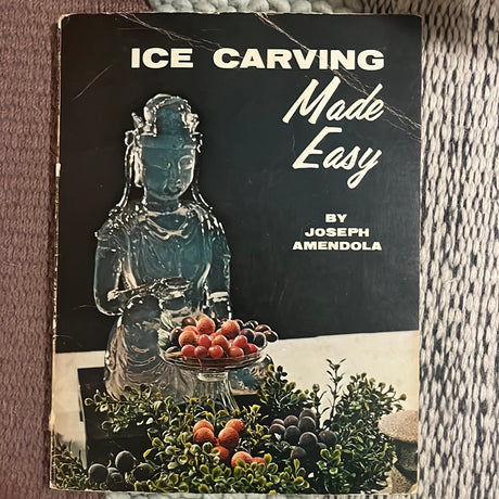 Cover of Ice Carving Made Easy, featuring a statue of a woman and fruit, reflecting the book's focus on artistic ice carving techniques.