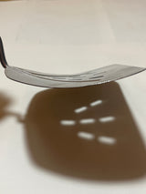 Foley Stainless Steel Wide Slotted Turner Lifter MPLS Curved Spatula, showcasing a thin, sturdy blade with rectangular slots and a well-preserved resin handle.