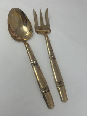 Thai brass serving fork and spoon set with embossed handles, perfect for enhancing both everyday meals and special occasions with elegance and functionality.