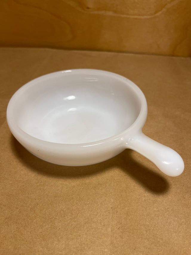 Glasbake milk glass soup or casserole bowl with handle, ideal for oven-to-table serving, perfect for individual portions of gratins or small desserts.
