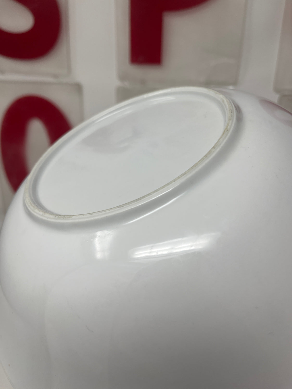 Close-up of a vintage large spaghetti bowl with groovy font inscription, ideal for pasta. Hand wash only to prevent chipping.