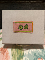 “Avocado Slice” (2026) - embroidery on canvas - Vibrantly Earthy
