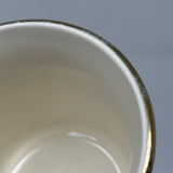 Close-up of University of Pittsburgh School of Pharmacy mug with gold rim. One side features School of Pharmacy in blue, the other the university crest.