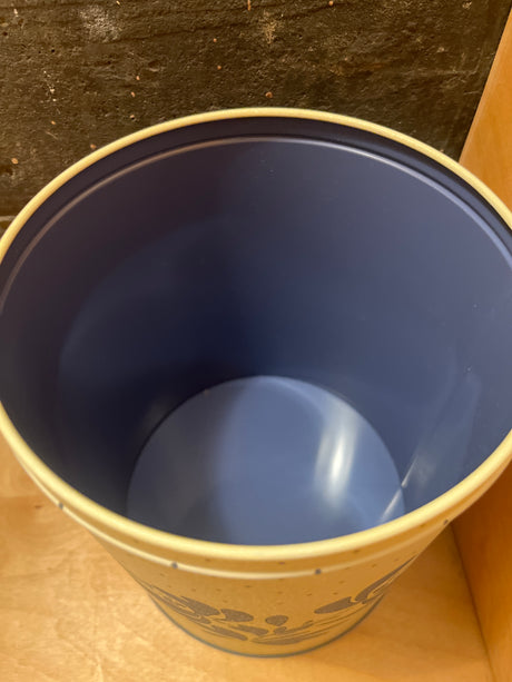 Pfaltzgraff vintage polka dot food storage tin, featuring a floral pattern on a round, open container, perfect for keeping cookies fresh with its airtight seal.