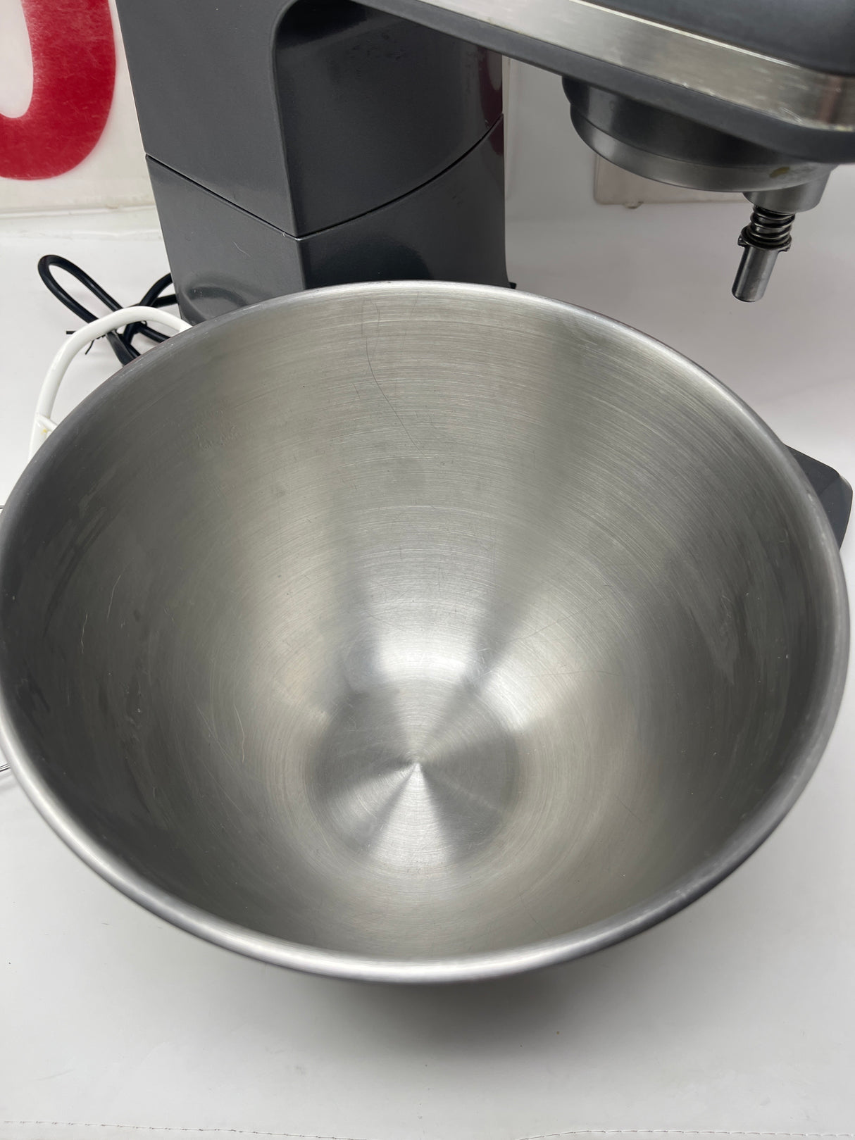 Farberware 6-speed professional mixer with sturdy metal bowl, ideal for baking. Includes three paddle attachments for versatile mixing. Perfect for handling sticky dough effortlessly.