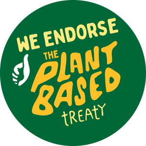 Green circular sticker with yellow text and a white hand icon, endorsing the plant-based treaty.