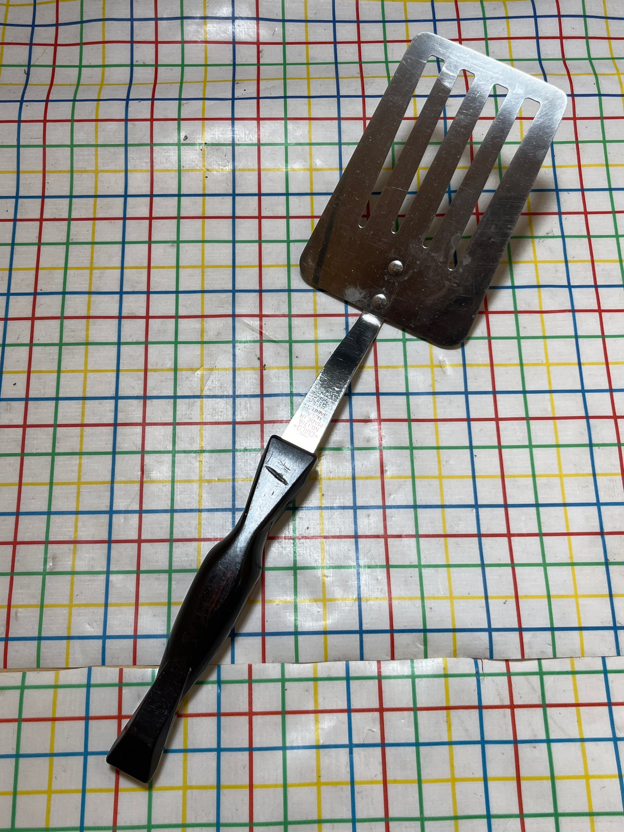 Slotted spatula turner - stainless steel with Bakelite handle - vintage Cutco 1716