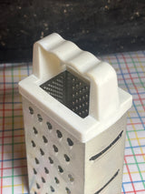 Box grater - stainless steel with white plastic handle