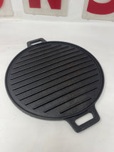 Cast iron ridged grill pan with handles, designed for gas stoves and outdoor grills, ideal for searing paninis, veggies, and plant-based proteins.