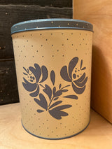 Pfaltzgraff vintage polka dot food storage tin, cylindrical with floral motifs and polka dots, airtight lid to keep cookies fresh.