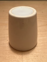 Teeny weeny espresso cup set upside-down, showcasing its unglazed base. Perfect for a single espresso shot, adding charm to your cafe table.