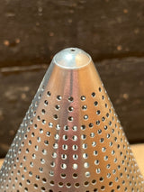 Close-up of the Tiny pointy cone sieve strainer - aluminum, featuring a perforated design, sturdy handle, and a small dent at the cone tip.