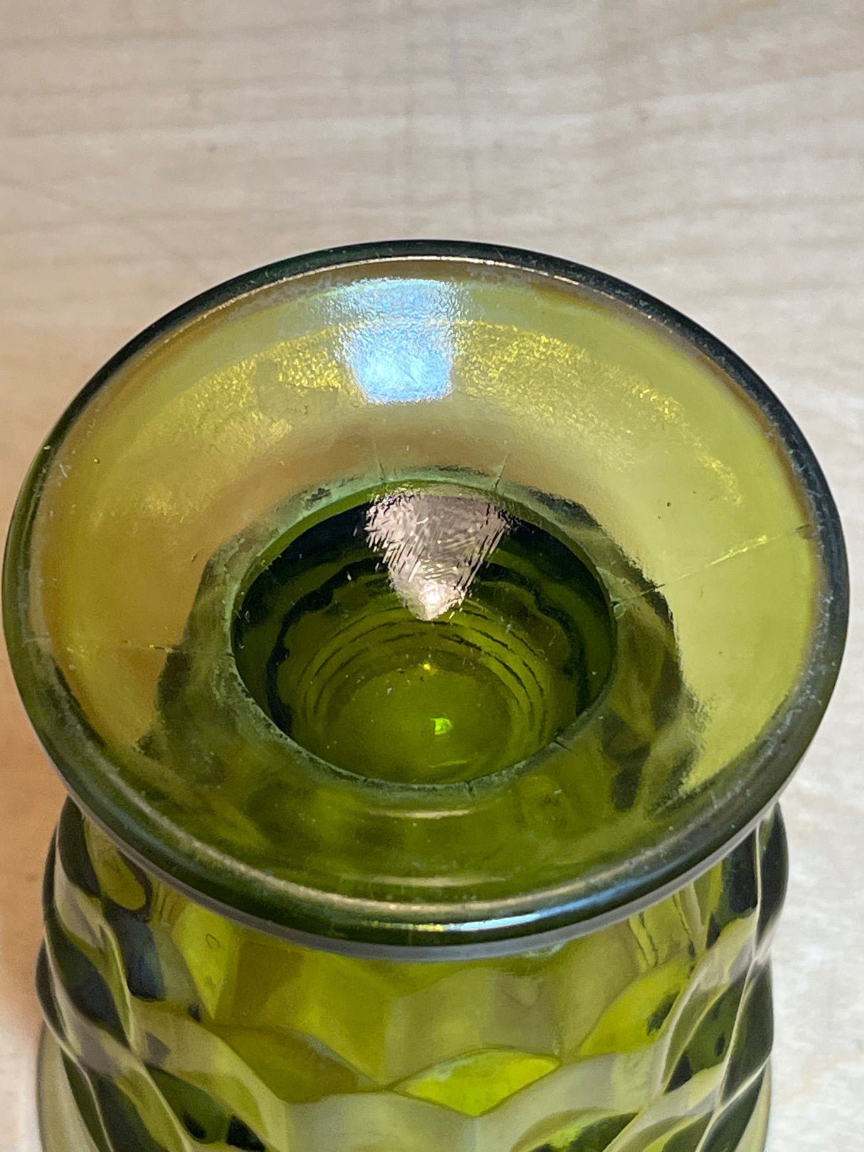 Whitehall Indiana green cubist glass vessel with a textured pattern and flared rim, viewed from above, showcasing its decorative design.