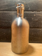 Stainless steel 64oz growler with a swing-top, clamp-down lid, designed for carrying beverages like water or beer.