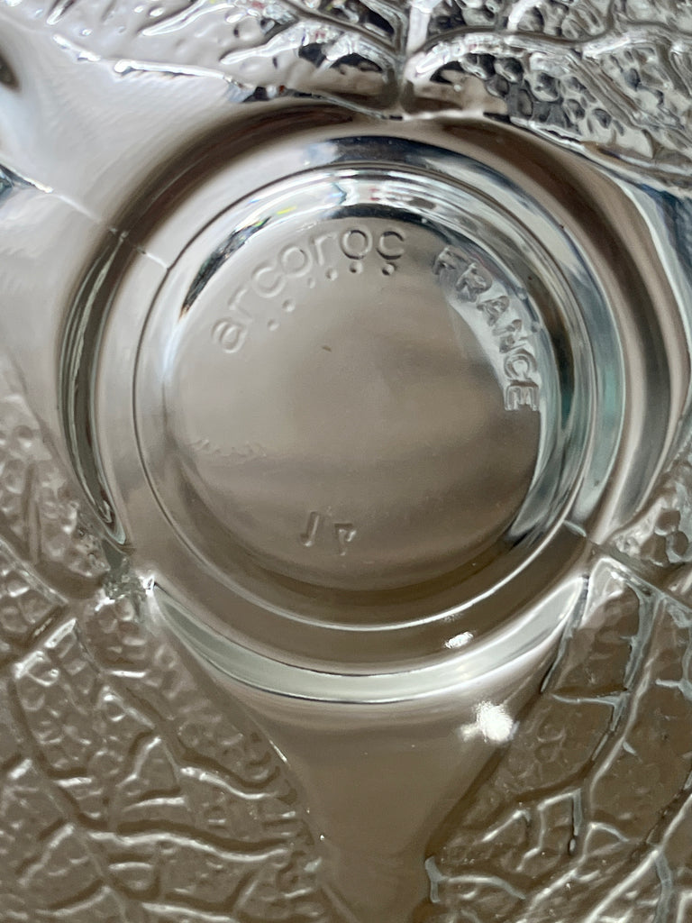 Close-up of Arcoroc punch bowl set with embossed leaf pattern, featuring a glass bowl and 12 cups, perfect for a garden party.