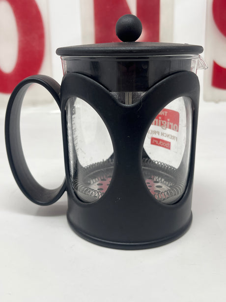 Bodum Kenya single-serve French press coffee maker with a lid, showcasing its sleek design for brewing rich, flavorful coffee in minutes.