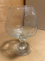 Libbey Chivalry glassware: A clear snifter with a rounded bowl, short, thick stem, and foot, ideal for enjoying brandy or cognac.
