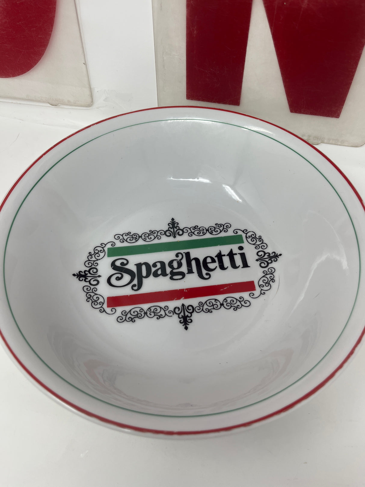 Vintage large spaghetti bowl with a groovy font inscription, perfect for pasta lovers. Hand wash only to maintain the inscription's integrity.