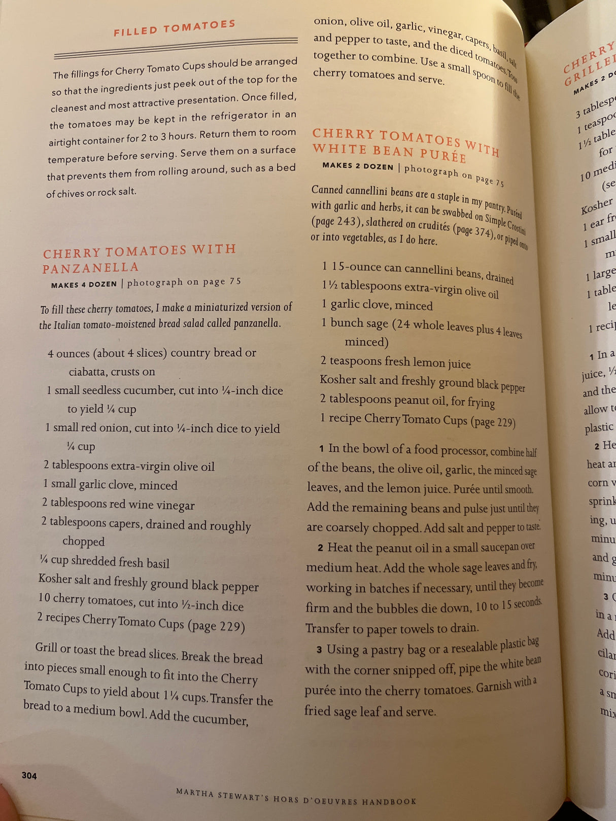 Martha Stewart’s Hors d’Œuvres Handbook, pages show “Filled Tomatoes” recipes: “Cherry Tomatoes with Panzanella” and “Cherry Tomatoes with White Bean Purée,” detailing ingredients and preparation steps.
