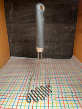 Potato masher - stainless steel with black soft grip handle - IKEA