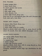 Trader Vic’s Bartender’s Guide (Revised 1972) features vintage cocktail recipes, including Foul Weather, Frozen Mint Daiquiri, and Frozen Peach Daiquiri, with minor wear on corners.