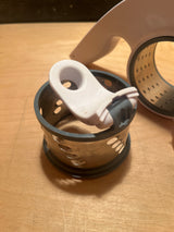 Rotary grater with two drums - Zyliss, featuring perforated-metal baskets, rubber gaskets, and a plastic handle, ideal for grating cheese efficiently.