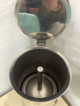 Ilsa Turbo Express 6-Cup 18/10 stainless steel stovetop espresso pot interior showing central riser-tube and empty chamber, ready for brewing.