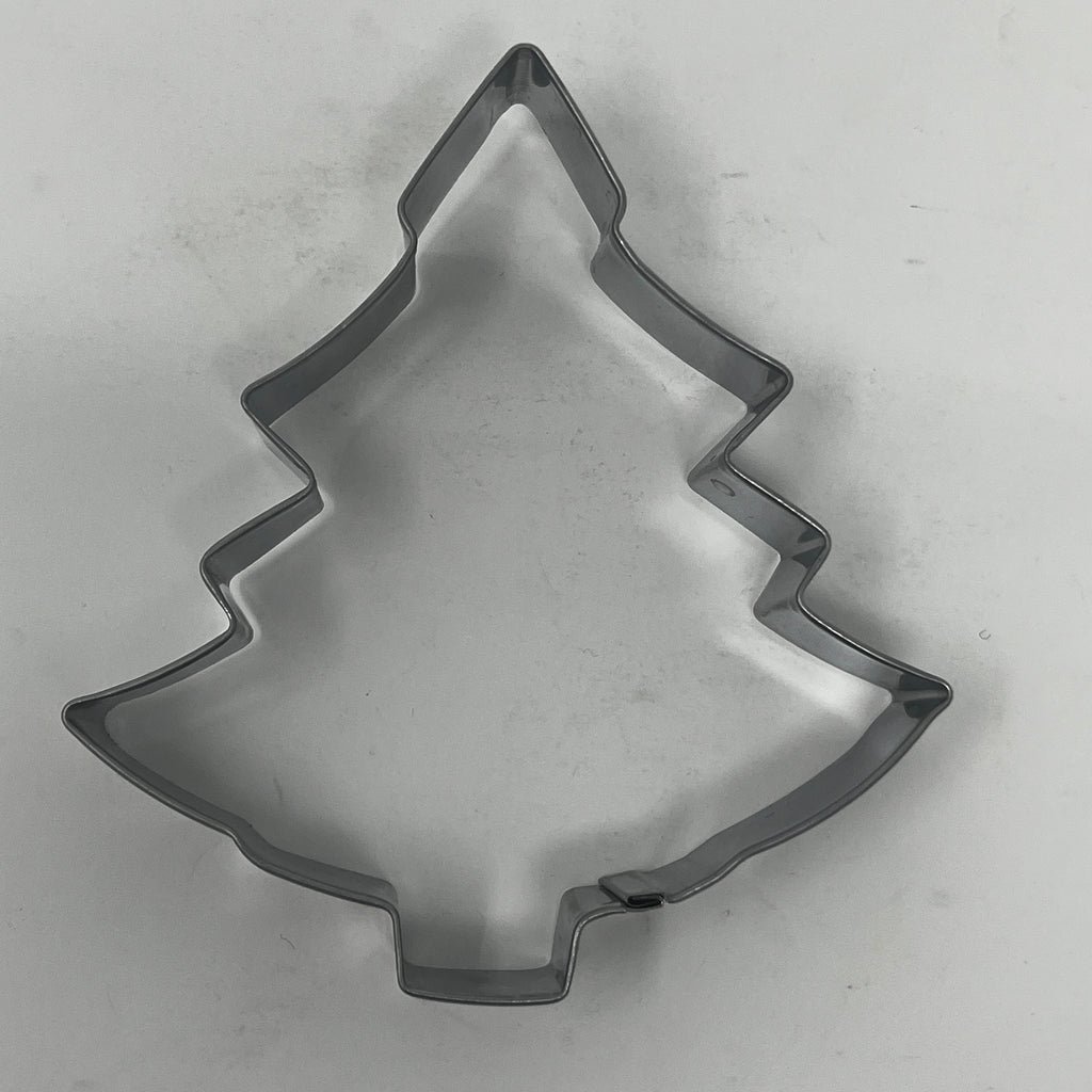 Mid century metal cookie cutter in tree shape, part of a trove of holiday and celestial designs from the 1930s. From Spoons Kitchen Exchange. 