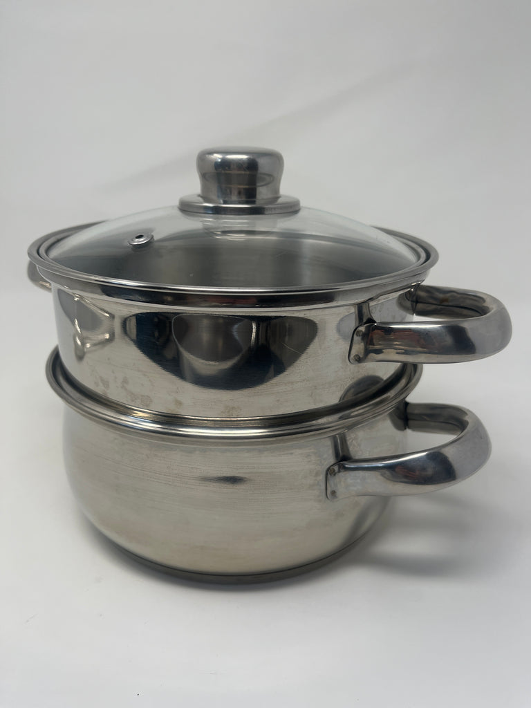 A 3-Quart stainless steel steamer pot with a glass lid, featuring steel tube and hollow carry handles. Ideal for cooking vegetables, fish, and dumplings with gentle heat.