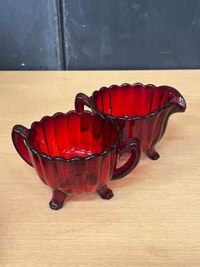 Imperial Glass Co. ruby red creamer and sugar bowl set showcasing intricate details, with each piece in excellent condition, capturing 1950s elegance.