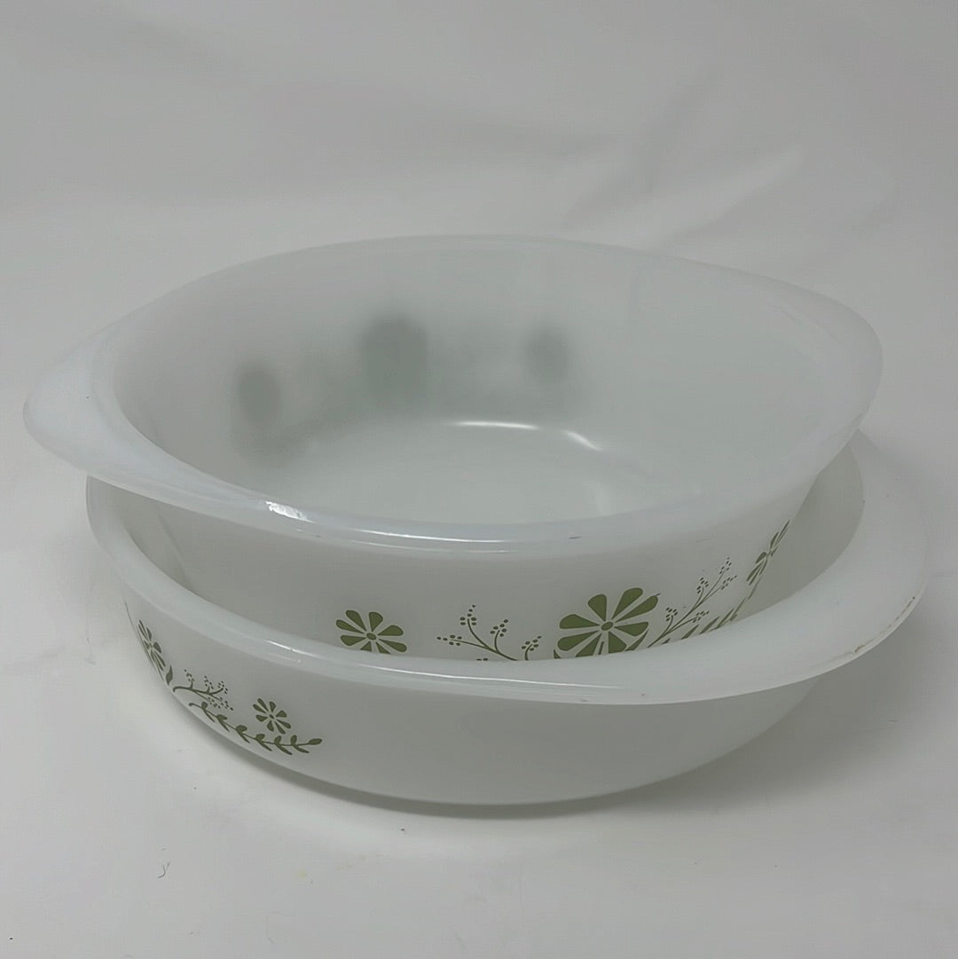 Stack of two Glasbake casserole dishes with green floral motif on white glass. From Spoons Kitchen Exchange. 