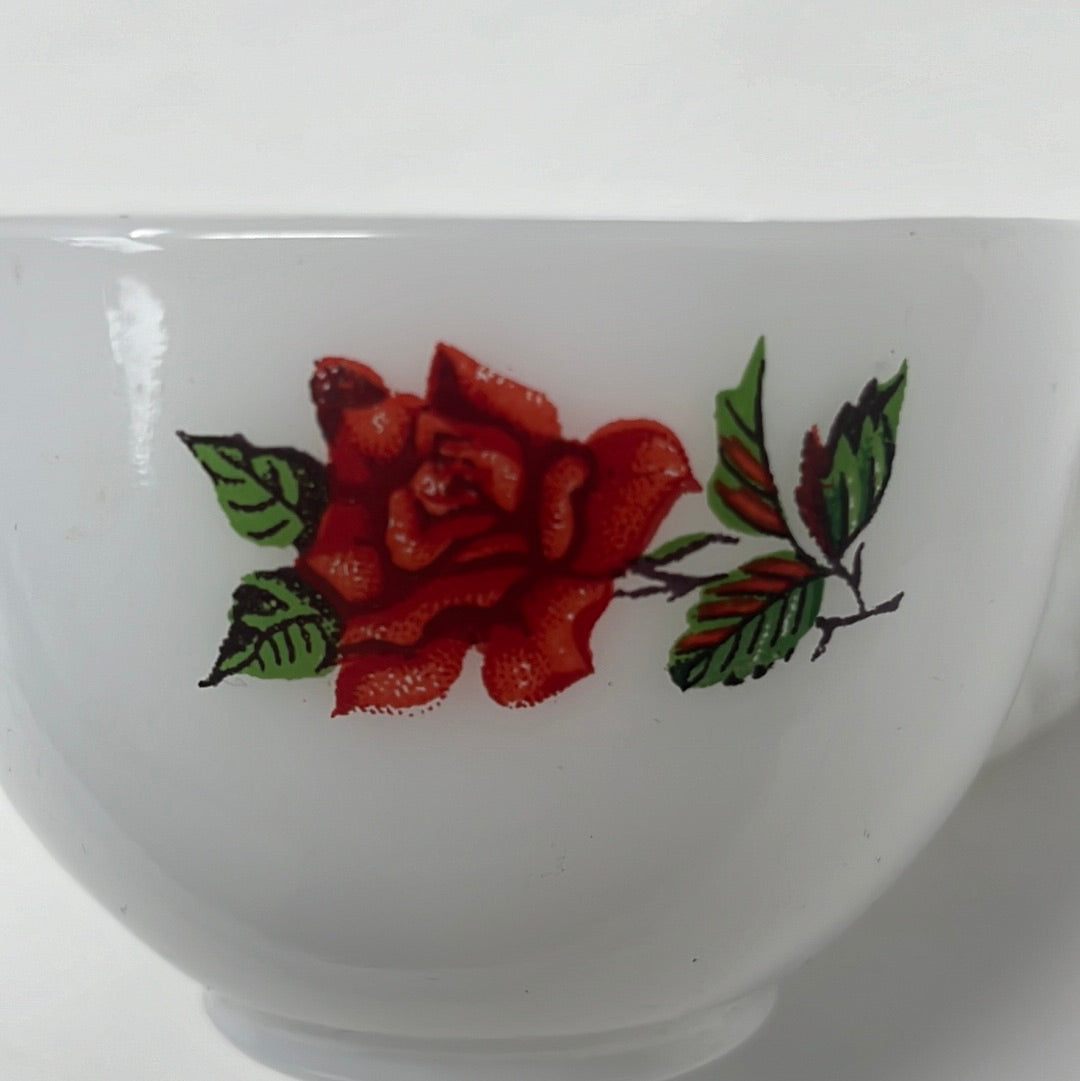 White milk glass teacup and saucer set by Federal Glass Co. Features red rose design. Excellent condition. Perfect for elegant tea times.