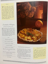 The Villa Table cookbook open to a lentil recipe, featuring juniper-flavored lentils and baked potatoes with rosemary, alongside cooking tips and ingredient list.