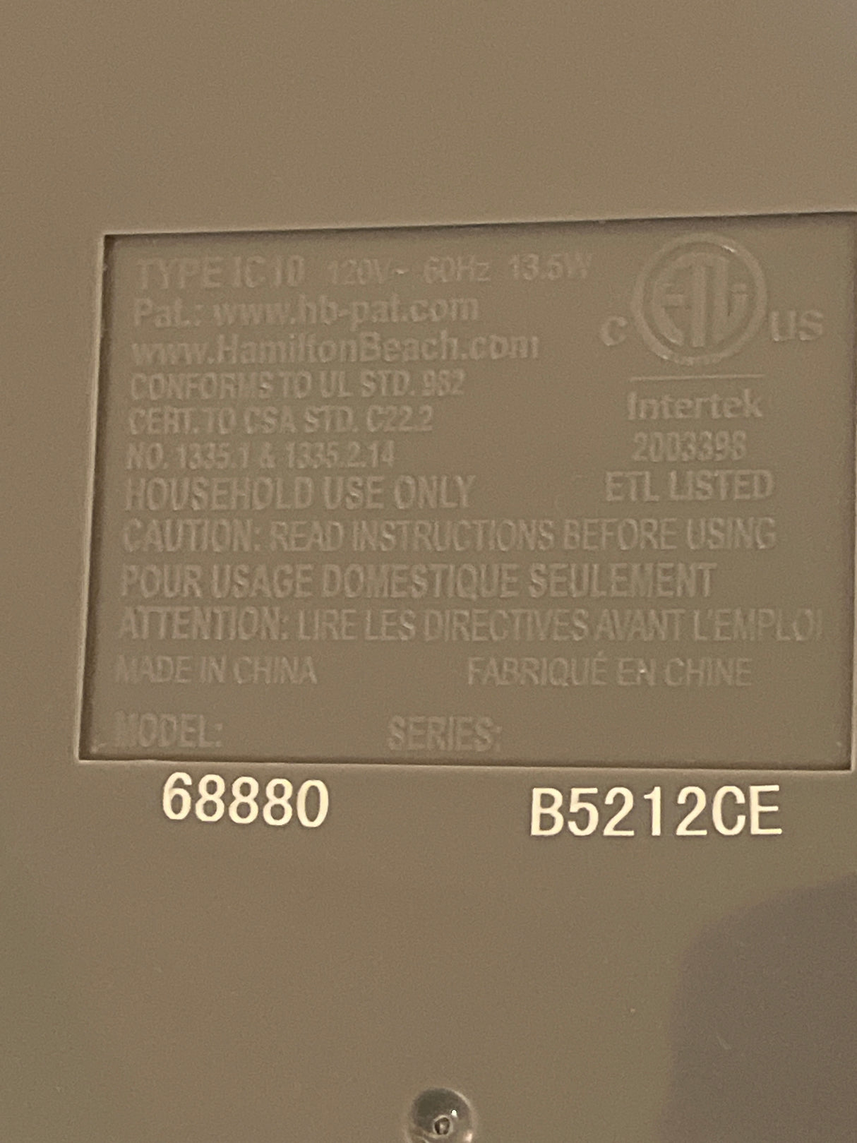 Automatic ice cream maker - Hamilton Beach 68880 compliance plate showing model, type IC10, electrical rating, certifications, and manufacturer details for household use only.