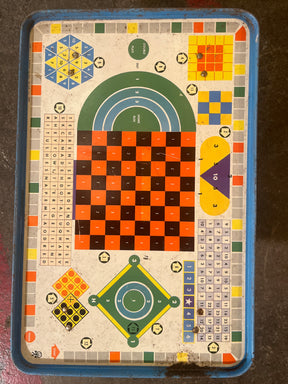 Vintage Metal Lap Serving Tray Game by Pressman Toy Co., featuring various mini-games and a central checkerboard, ideal for post-meal entertainment. Some surface rust present.