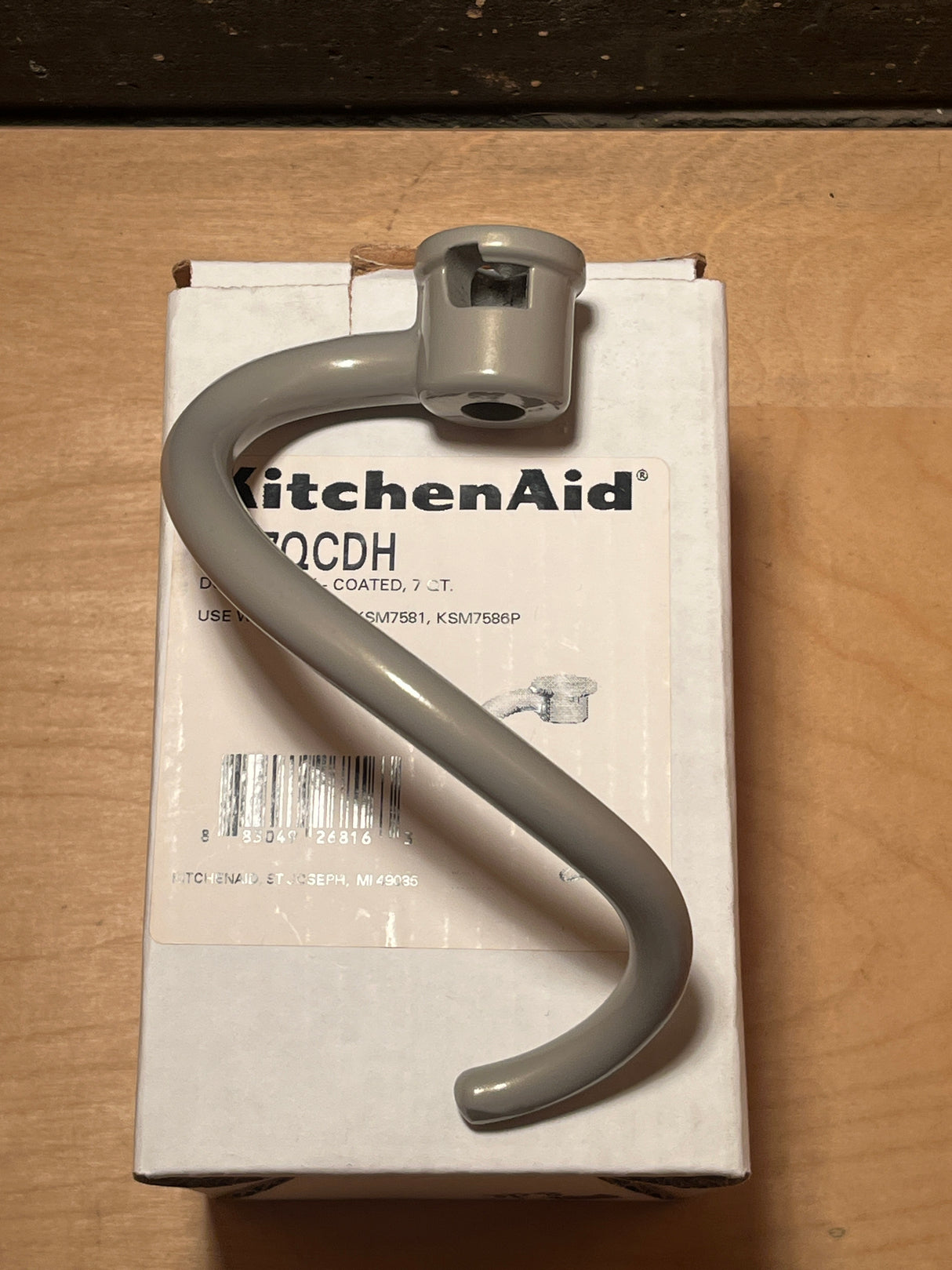 Dough hook attachment - KitchenAid stand mixer 7 QT Models KSM7581, KSM7586P, shown new in box, featuring an S-shaped, coated design for kneading.
