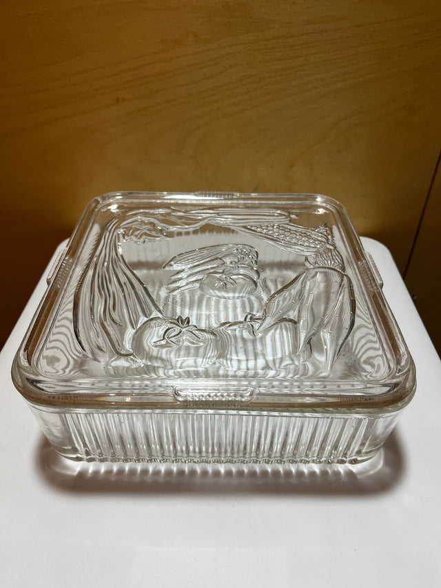 Antique Federal Glass square food container, 1940s, with lid embossed with produce illustrations and raised grooves on the bottom for grip.