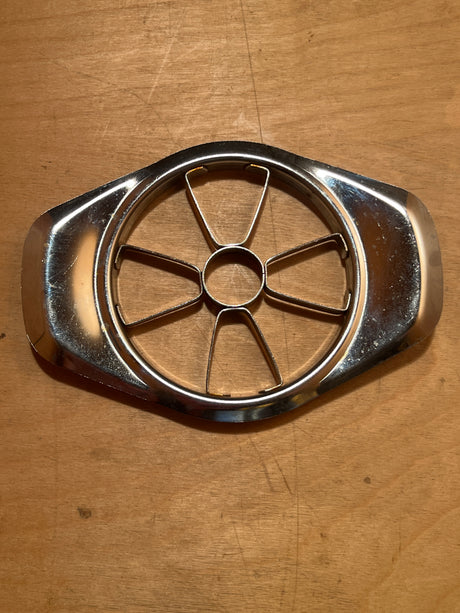 Stainless steel apple slicer with sharp blades for easy coring and slicing into six wedges, ideal for quick, efficient fruit preparation.