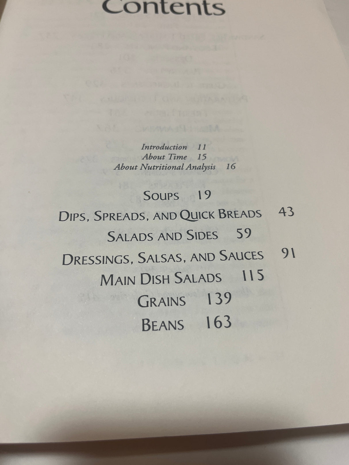 Contents page from Moosewood Restaurant Cooks at Home, listing sections like Soups, Salads, and Main Dishes, emphasizing quick recipes for everyday cooking.
